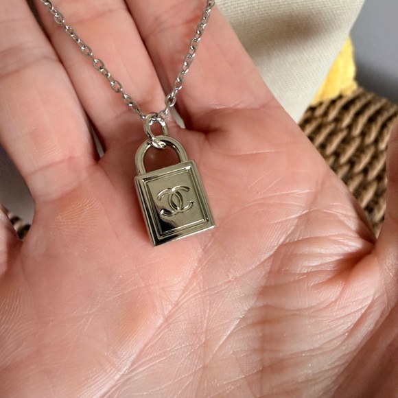 CHANEL Jewelry - Chanel Silver Padlock GWP Pendant on 19” Silver Chain